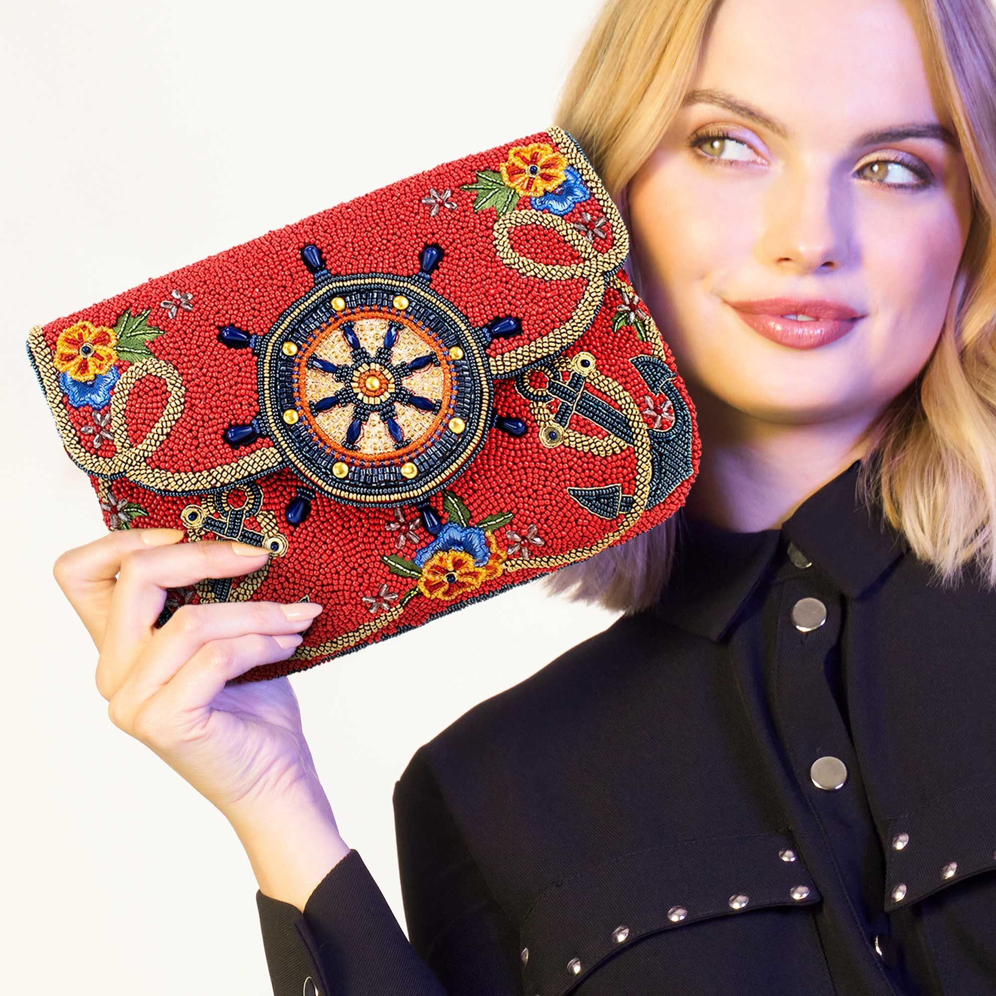 Captain's Helm Beaded Crossbody Clutch Handbag being held by a model