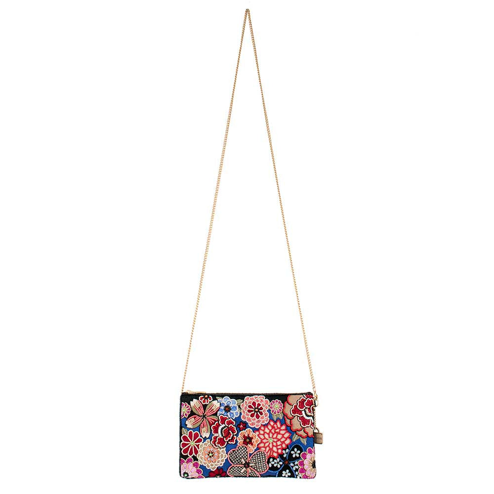 Floral embroidered clutch purse with a gold chain strap.