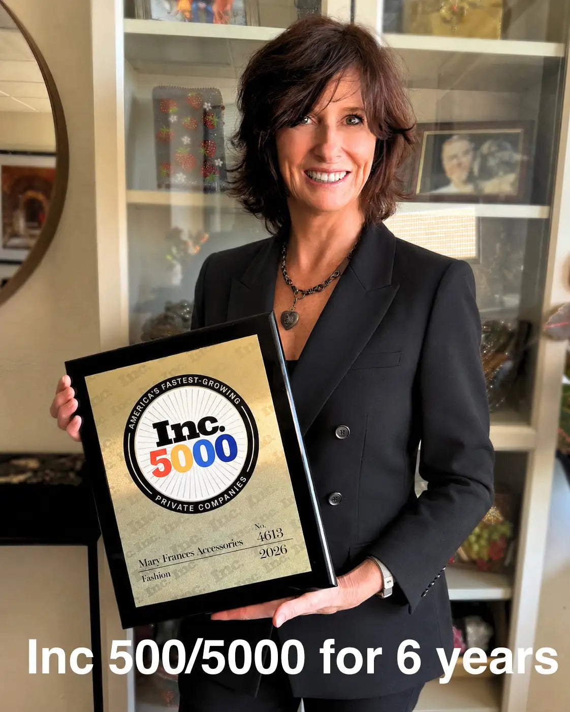 Black-framed award plaque with a gold-toned center displaying the inc.