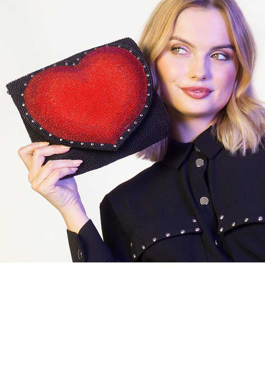 Model holding Big Heart Crossbody Clutch Handbag