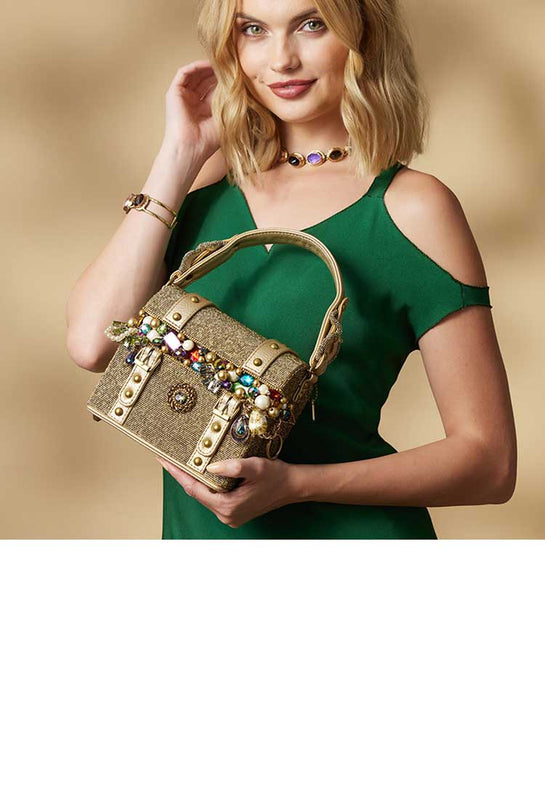 Model holding Secret Treasure Top Handle Beaded Treasure Chest Handbag