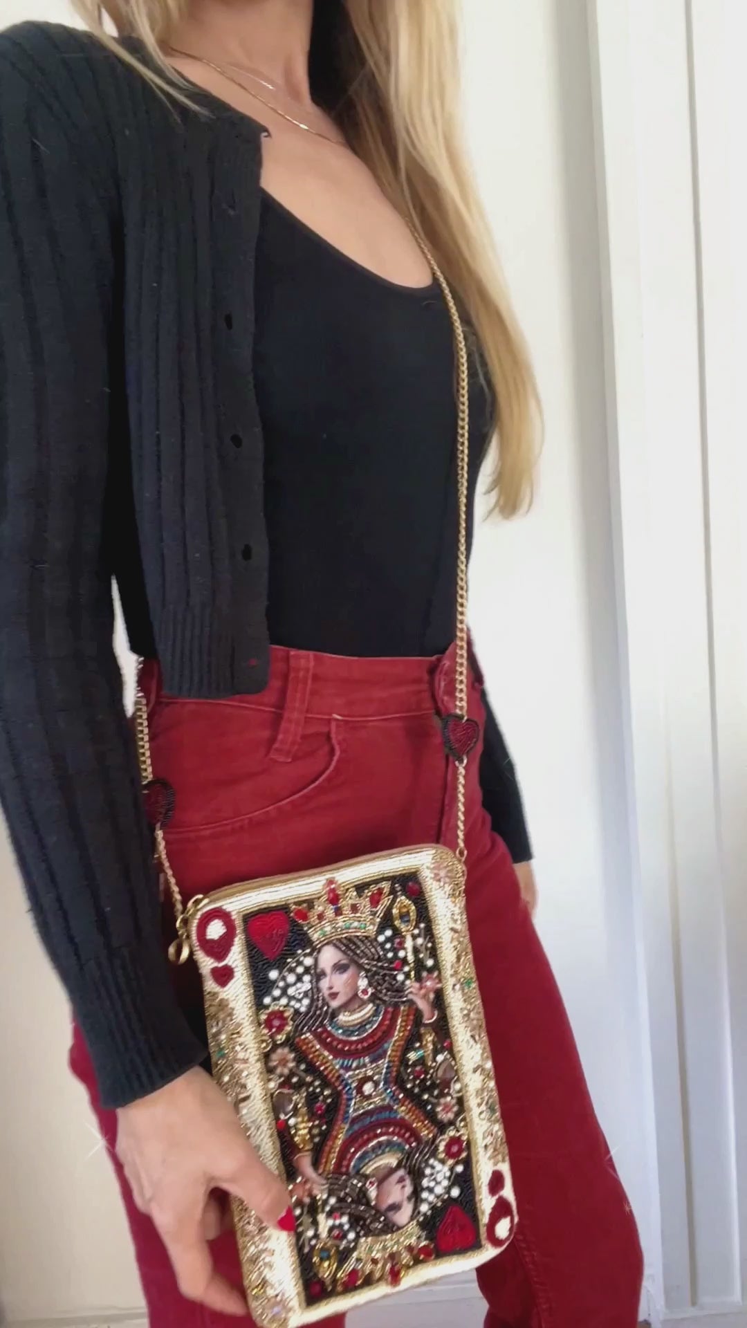Model wearing The Queen mini handbag