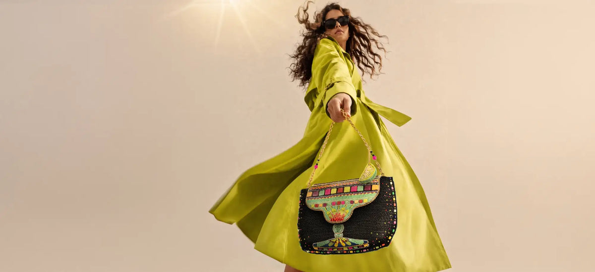 A vibrant lime green satin trench coat with a flowing, dramatic silhouette.